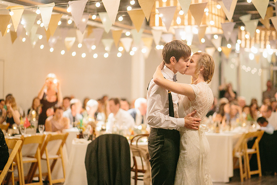 Bride and groom kissing after their first dance