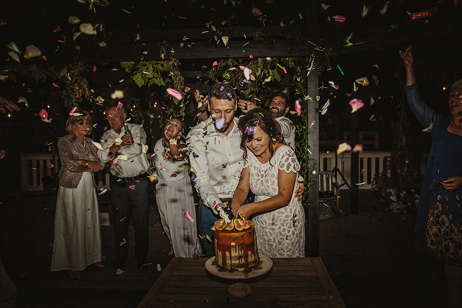 Bride and groom cutting a cake at their wedding